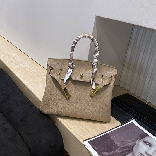 Classic Women's Fashionable Gold Genuine Leather Handbags