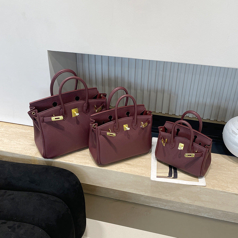 Classic Women's Fashionable Gold Genuine Leather Handbags