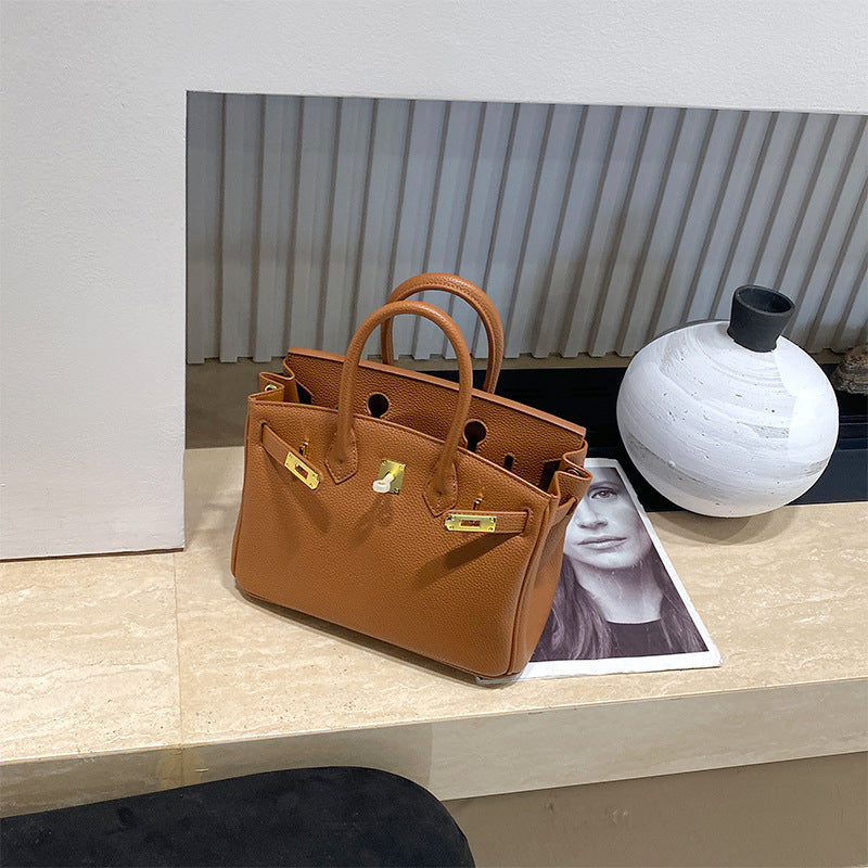 Classic Women's Fashionable Gold Genuine Leather Handbags