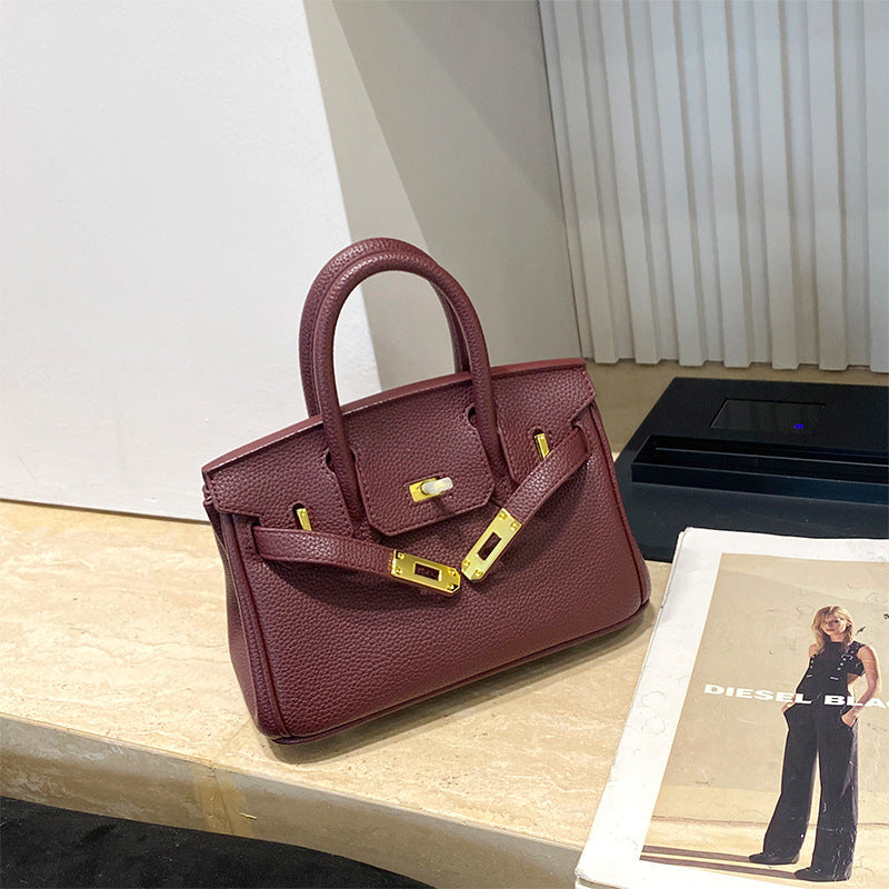 Classic Women's Fashionable Gold Genuine Leather Handbags