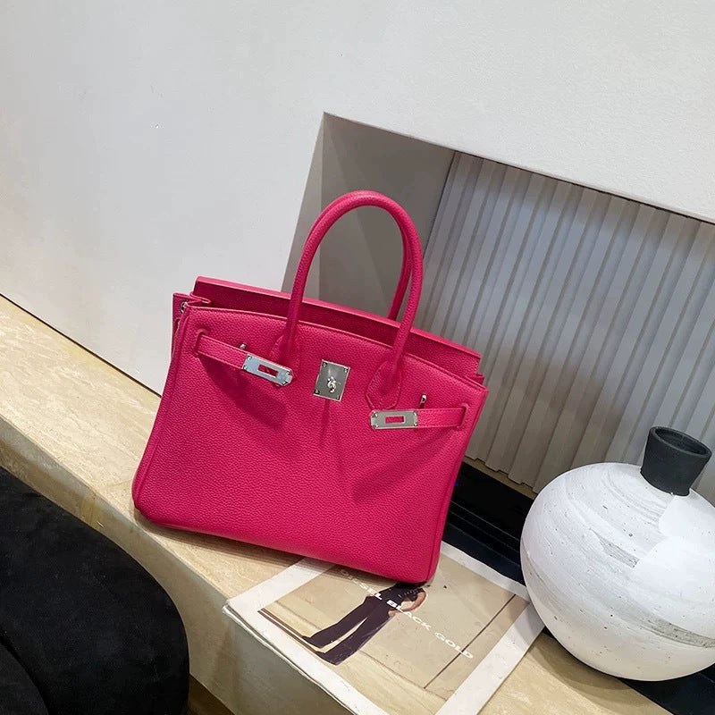 Classic Women's Fashionable Gold Genuine Leather Handbags