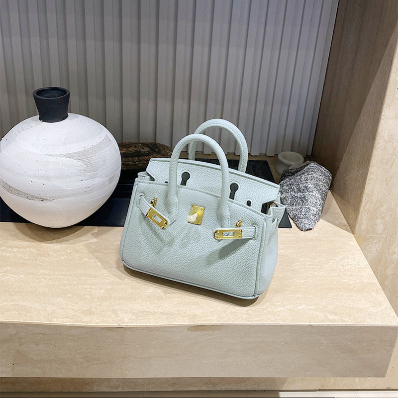 Classic Women's Fashionable Gold Genuine Leather Handbags