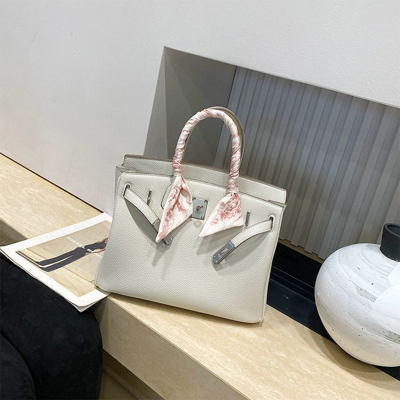 Classic Women's Fashionable Gold Genuine Leather Handbags