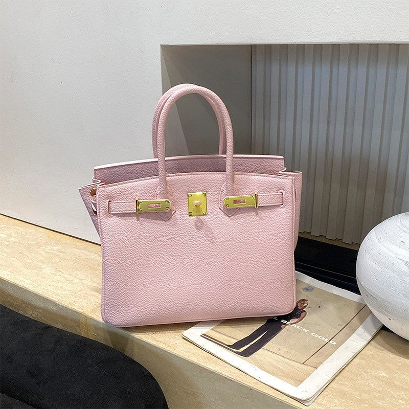 Classic Women's Fashionable Gold Genuine Leather Handbags