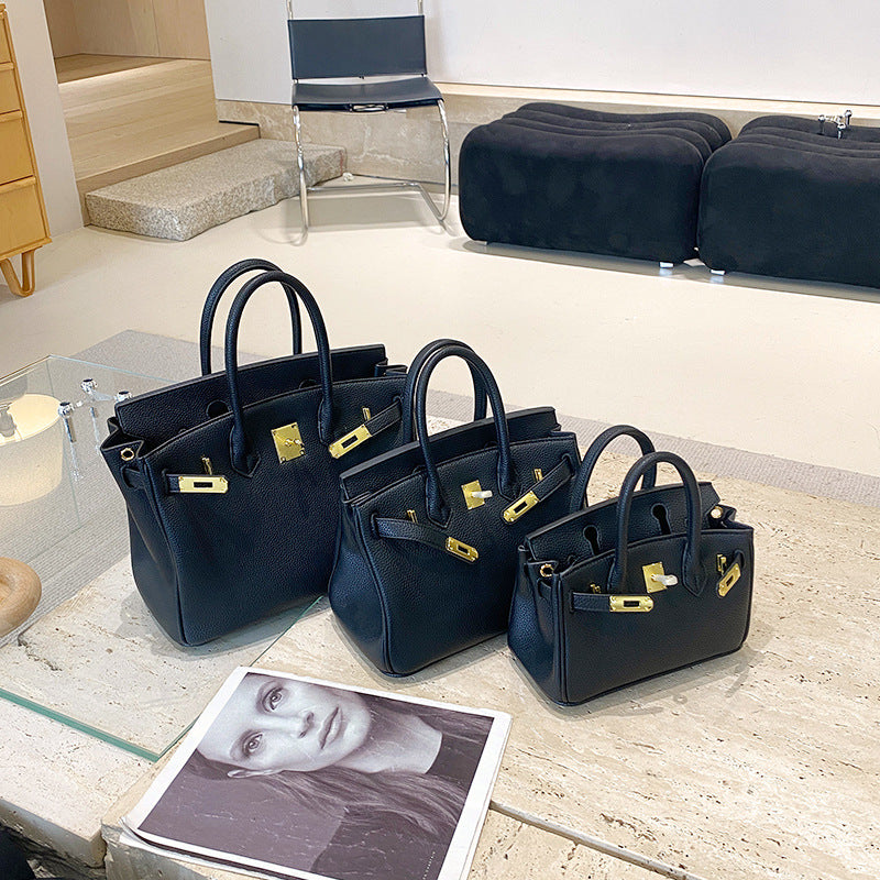 Classic Women's Fashionable Gold Genuine Leather Handbags