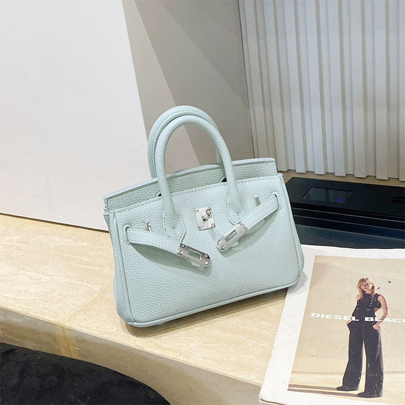 Classic Women's Fashionable Gold Genuine Leather Handbags