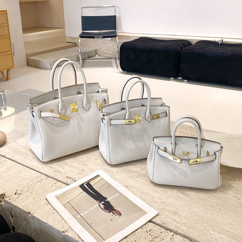 Classic Women's Fashionable Gold Genuine Leather Handbags